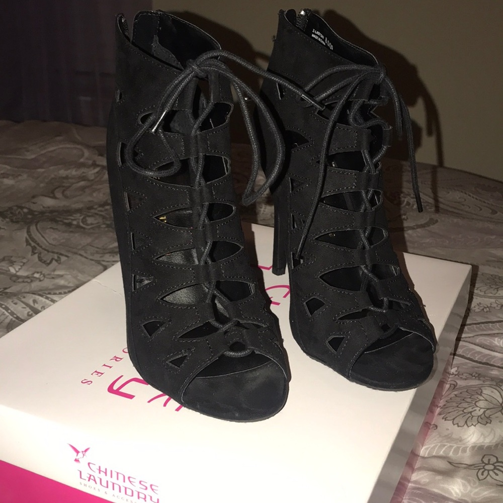 Black lace up heel bootie with back zipper